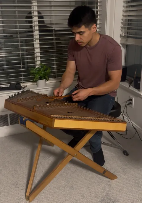Playing the hammered dulcimer at home