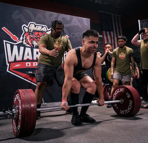 Mark Heimann deadlifting on a competition platform